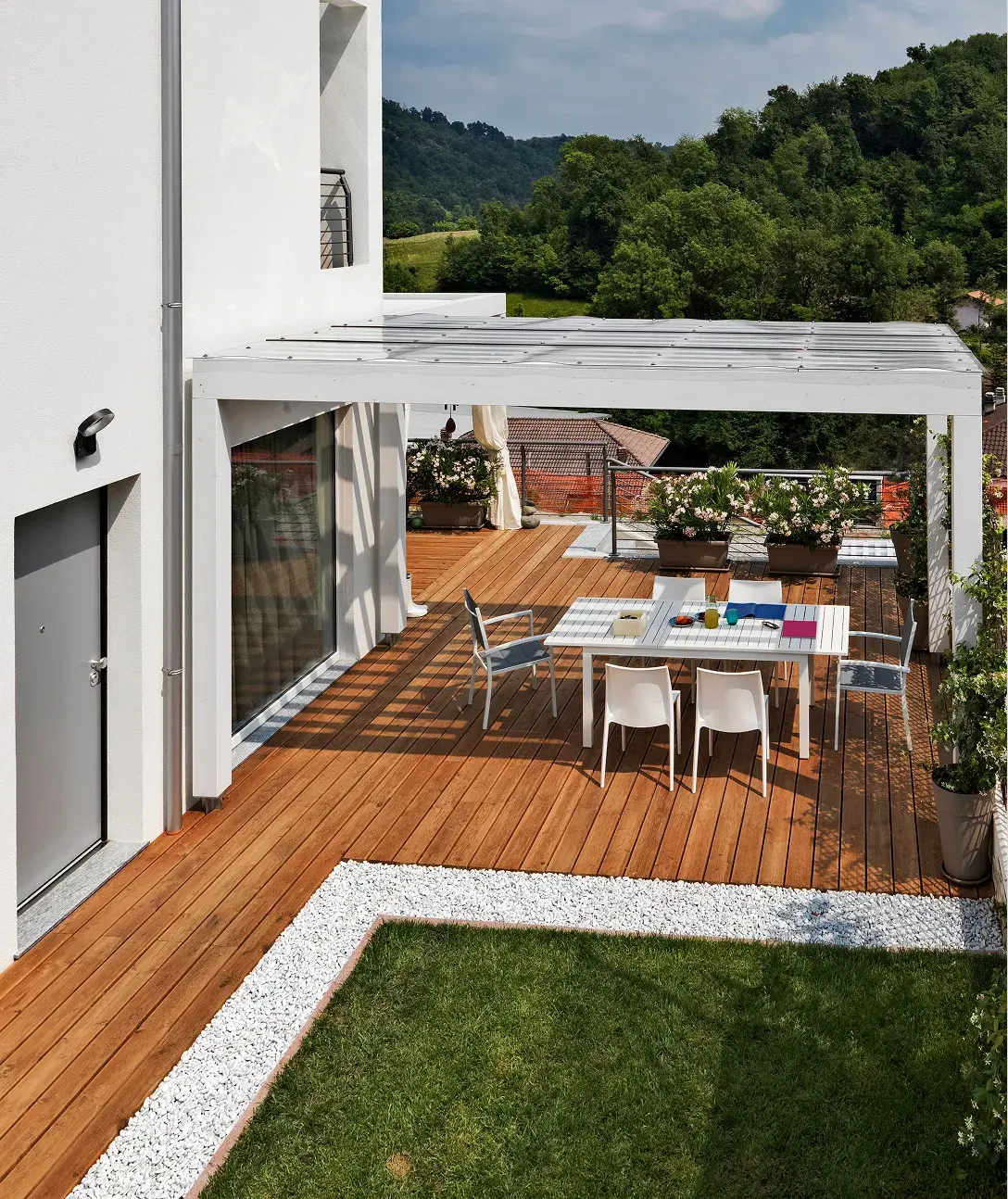 After: outdoor terrace with timber deck and dining setting